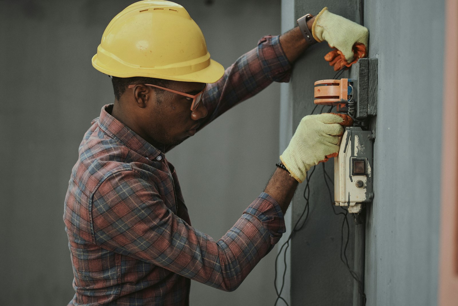 Electrician working on an electrical panel